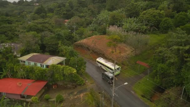 Fly Buildings Vehicles Tropical Village While Raining Green Dense Vegetation — Stockvideo