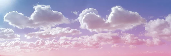 Beautiful cloud formation and sun shine - pink lilac blue sky and sun shining on big fluffy clouds providing a gorgeous summer cloudscape background with copy space ideal for holiday or spiritual themes