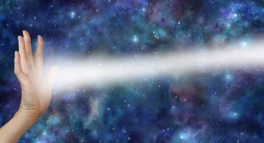 Beaming pranic scalar reiki healing energy from palm chakra - female open hand with beam of white light coming from palm against a cosmic dark night sky background and space for copy 