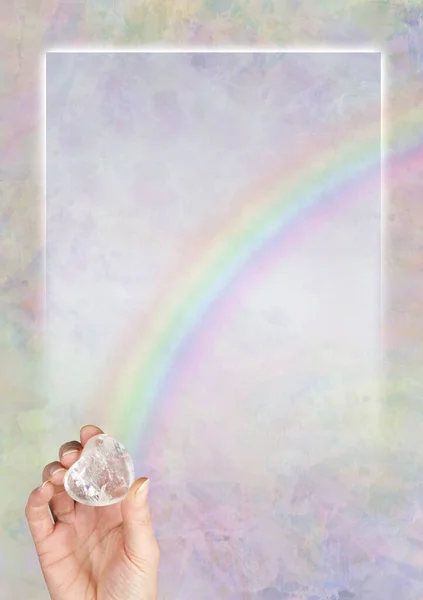 Crystal Healers Rainbow Border Template Background - female hand holding a large puff heart quartz with a rainbow arcing upwards from bottom left corner and copy space for advert, Certificate, Diploma, Award or accreditation