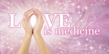 Love is Medicine and the Ultimate Healer - Female hands making the O of LOVE IS MEDICINE on a bright sparkling flowing background  clipart