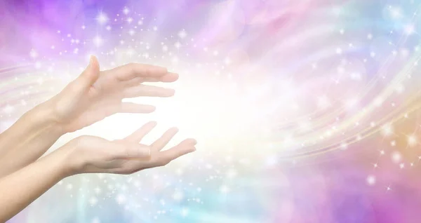 stock image Gentle Lightworker Healing Hands and white light message banner - female hands with sparkling energy vibes against a pastel coloured ethereal shimmering background with copy space spiritual message