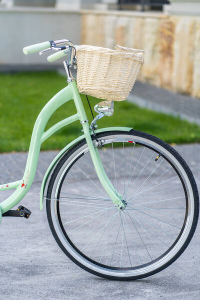 Vintage bicycle basket. Vintage bike on the street as background.