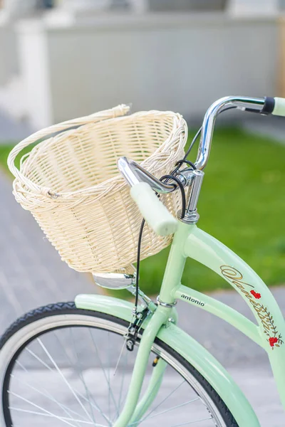 Vintage bicycle basket. Vintage bike on the street as background.