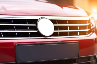 Close up detail on the red car taillight modern red crossover car. Exterior detail business automobile.