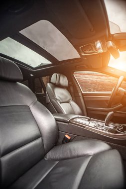 Car inside. Interior prestige modern car. Comfortable leather seats. Black cockpit with on isolated white background.