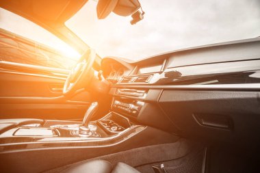 Car inside. Interior prestige modern car. Comfortable leather seats. Black cockpit with on isolated white background.