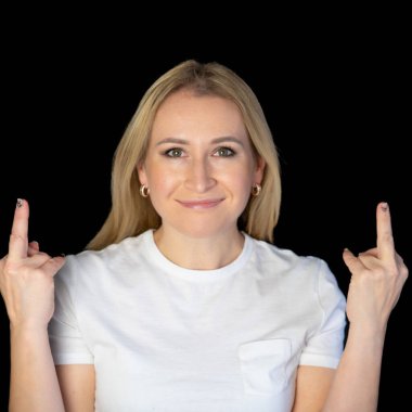 Closeup cropped portrait of nervous cheeky annoyed blonde woman showing teeth gesturing two fuck off signs with middle finger isolated on blue background