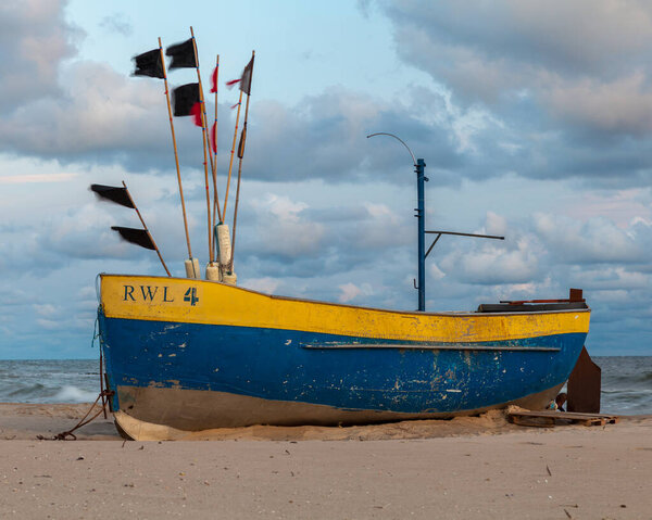 Fishing boat on the beach in Rewal circa August 2021 in Rewal.