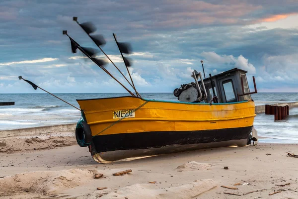 stock image Fishing boat on the beach in Niechorz