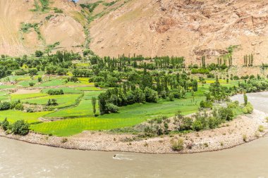 Beautiful view of the Pamir, Afghanistan and Panj River along the Wachan Corridor clipart