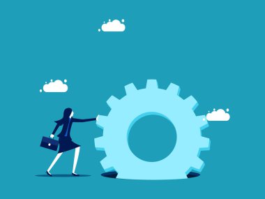 Çaba. Çalışkan bir iş kadını, bir çarkın içine sıkışmış bir dişliyi itiyor.