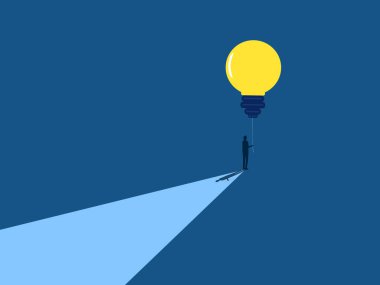 Businessman holding a balloon of wisdom light bulb shining light