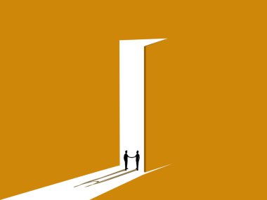 Girişte el sıkışan iki işadamı.