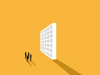 Vergileri yükseltiyorum, takım işadamı dev bir duvara bakıyor.