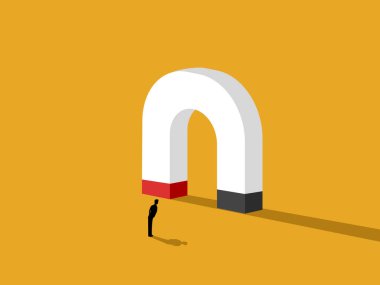 Motivasyon, adam büyük mıknatısa bakıyor.