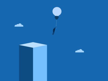 Güvenli bölgeden ampul balonları taşıyan bir iş adamı.