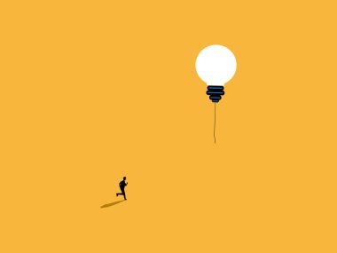 İş adamı hayallerinin ampulünün peşinden koşar.