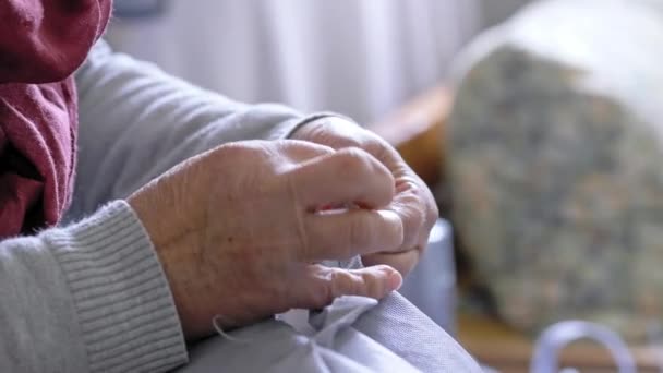 Close Elderly Woman Sews Hand Needle Thread Selective Focus — Stock Video