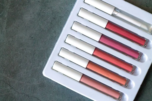 Set Liquid Lipsticks Lip Gloss Make Stone Table Top View — Stock Photo, Image