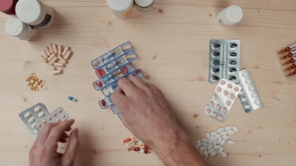 Man Sorting Pills Table — Stock Video