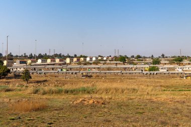 Güney Afrika 'nın Gauteng kentindeki Johannesburg Büyükşehir Belediyesi' nin ünlü kasabası Soweto 'nun manzarası. Adı Güney Batı Kasabası 'nın İngilizce kısaltması.