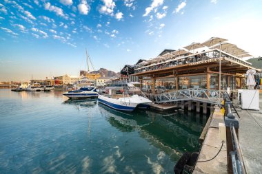 Cape Town, South Africa - August 31, 2022: V&A, Victoria and Alfred Waterfront, the famous neighborhood located at the port of Cape Town, South Africa clipart