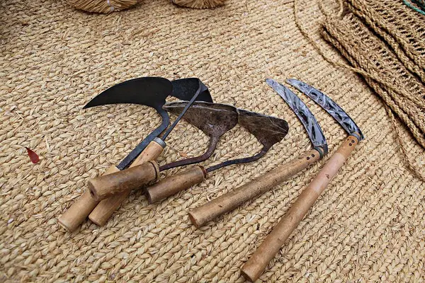 a bunch of tools laying on a woven surface