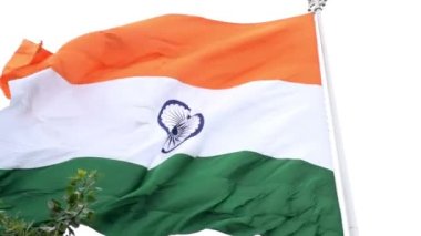 India flag flying high at Connaught Place with pride in blue sky, India flag fluttering, Indian Flag on Independence Day and Republic Day of India, tilt up shot, Waving Indian flag, Har Ghar Tiranga