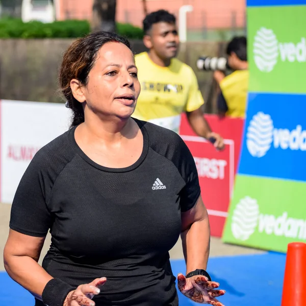 stock image New Delhi, India - October 16 2022 - Vedanta Delhi Half Marathon race after covid in which marathon participants about to cross the finish line, Delhi Half Marathon 2022