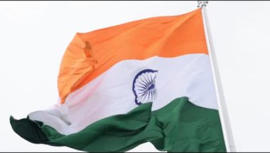 India flag flying high at Connaught Place with pride in blue sky, India flag fluttering, Indian Flag on Independence Day and Republic Day of India, tilt up shot, Waving Indian flag, Har Ghar Tiranga