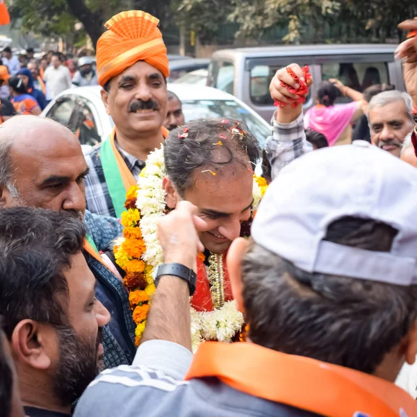 stock image Delhi, India, December 02 2022 -Bharatiya Janata Party (BJP) supporter during mega road show in support of BJP candidate Pankaj Luthara to file nomination papers ahead of MCD local body Elections 2022