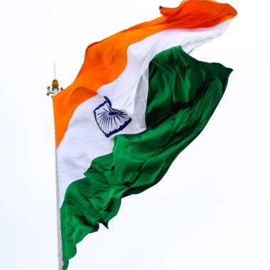 India flag flying high at Connaught Place with pride in blue sky, India flag fluttering, Indian Flag on Independence Day and Republic Day of India, tilt up shot, Waving Indian flag, Har Ghar Tiranga