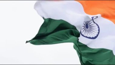 India flag flying high at Connaught Place with pride in blue sky, India flag fluttering, Indian Flag on Independence Day and Republic Day of India, tilt up shot, Waving Indian flag, Har Ghar Tiranga