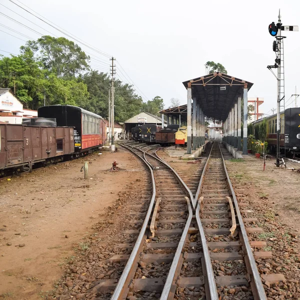 View of Toy train Railway Tracks from the middle during daytime near Kalka railway station in India, Toy train track view, Indian Railway junction, Heavy industry