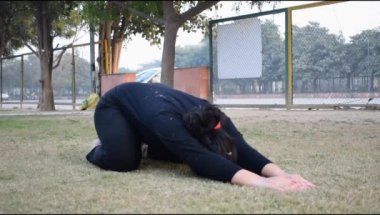 Young Indian woman practicing yoga outdoor in a park. Beautiful girl practice basic yoga pose. Calmness and relax, female happiness. Basic Yoga poses outdoor 