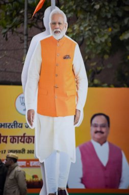 New Delhi, India - January 16 2023 - Prime Minister Narendra Modi cut out during BJP road show, the status of PM Modi while attending a big rally in the capital