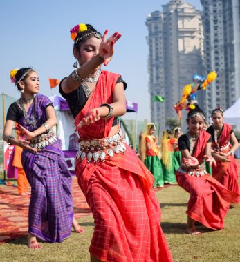 Delhi, India - December 11 2022 - Bharathanatyam Indian classical odissi dancers performing at stage. Beautiful Indian girl dancers in the posture of Indian dance. Indian classical dance Bharatanatyam