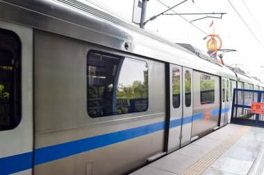 New Delhi India-June 21 2022 - Delhi Metro train arriving at Jhandewalan metro station in New Delhi, India, Asia, Public Metro departing from Jhandewalan station