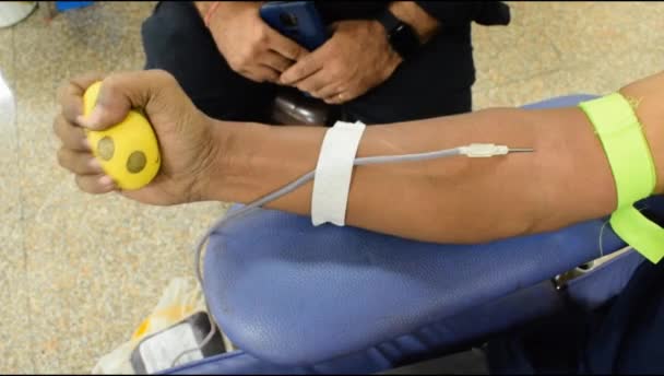 Blood Donor Blood Donation Camp Held Bouncy Ball Holding Hand — Stockvideo
