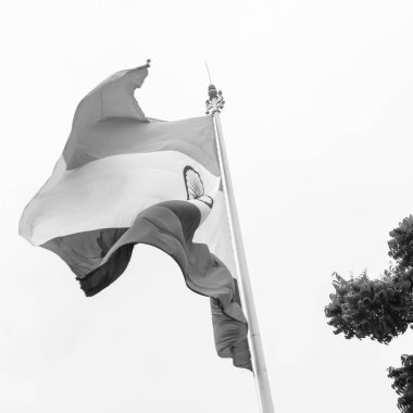 India flag flying high at Connaught Place with pride in blue sky, India flag fluttering, Indian Flag on Independence Day and Republic Day of India, tilt up shot, Waving Indian flag, Har Ghar Tiranga