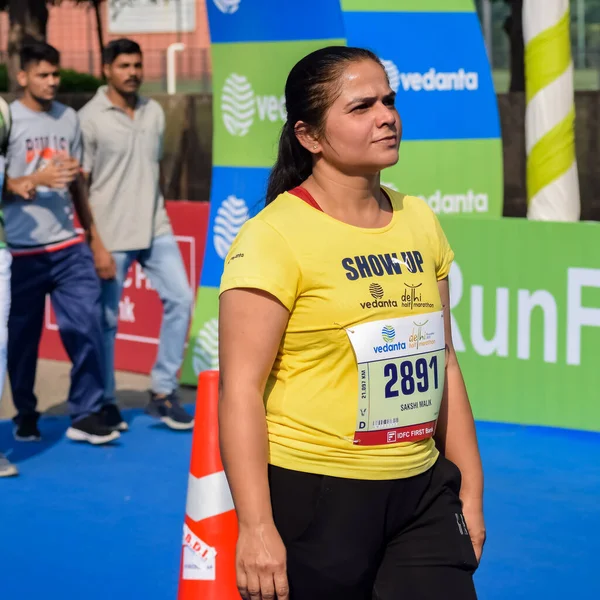 stock image New Delhi, India - October 16 2022 - Vedanta Delhi Half Marathon race after covid in which marathon participants about to cross the finish line, Delhi Half Marathon 2022