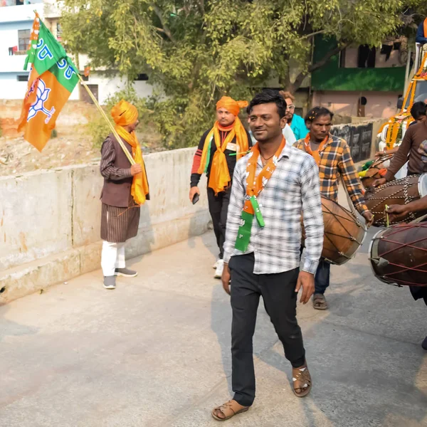 stock image Delhi, India, December 02 2022 -Bharatiya Janata Party (BJP) supporter during mega road show in support of BJP candidate Pankaj Luthara to file nomination papers ahead of MCD local body Elections 2022