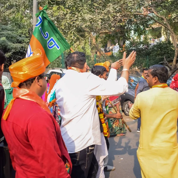 stock image Delhi, India, December 02 2022 -Bharatiya Janata Party (BJP) supporter during mega road show in support of BJP candidate Pankaj Luthara to file nomination papers ahead of MCD local body Elections 2022