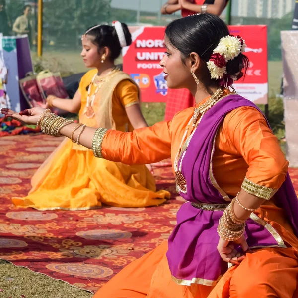 stock image Delhi, India - December 11 2022 - Bharathanatyam Indian classical odissi dancers performing at stage. Beautiful Indian girl dancers in the posture of Indian dance. Indian classical dance Bharatanatyam