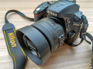 New Delhi, India, May 28 2023 - Nikon D5300 camera with 35mm f2.8 prime lens on plain background, Nikon DSLR camera shoot clipart