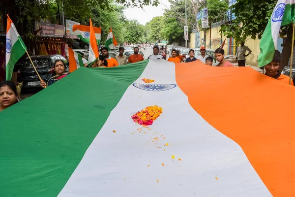 stock image Delhi, India -15 Aug 2022 - Large group of people during big Tiranga Yatra organized as part of the Azadi Ka Amrit Mahotsav to celeberate the 75 anniversary of India's independence, Indian Flag march