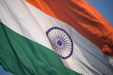 India flag flying high at Connaught Place with pride in blue sky, India flag fluttering, Indian Flag on Independence Day and Republic Day of India, tilt up shot, Waving Indian flag, Har Ghar Tiranga