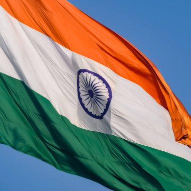 India flag flying high at Connaught Place with pride in blue sky, India flag fluttering, Indian Flag on Independence Day and Republic Day of India, tilt up shot, Waving Indian flag, Har Ghar Tiranga