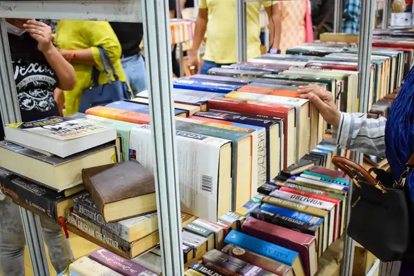 stock image New Delhi, India, September 09 2023 - Variety of Books on shelf inside a book-stall at Delhi International Book Fair, Selection of books on display in Annual Book Fair.